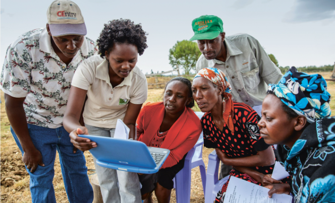 Veronica Wamiti, a BvAT extension officer, refers to the Infonet Content during a training session